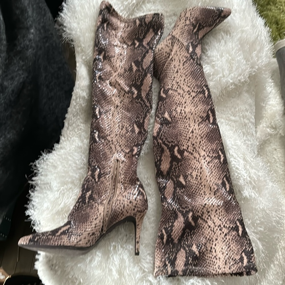 Snakeskin boots with black and a tan